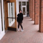 Female Student in Portico